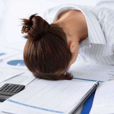 picture of woman sleeping at work in funny pose